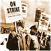 Older photo of men holding signs on strike.