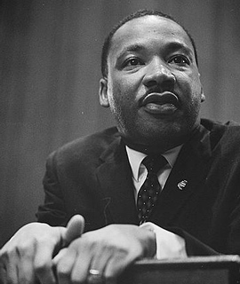 Martin Luther King Jr. standing at a podium